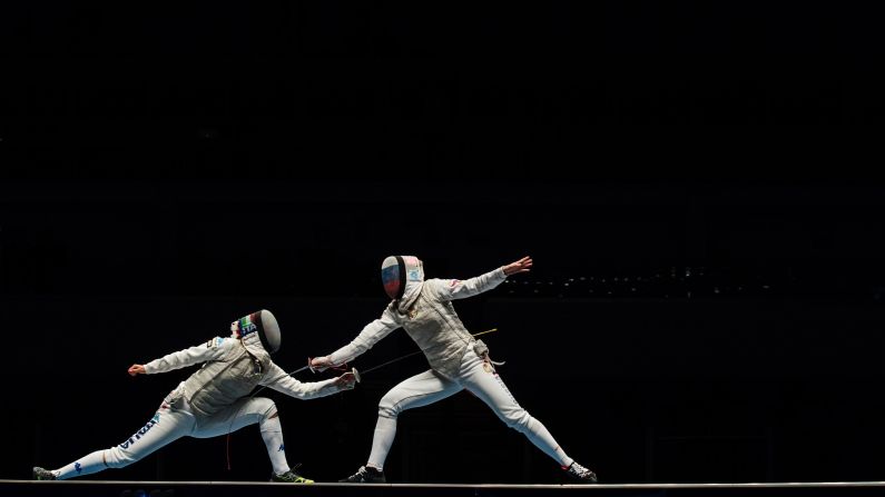 Italian fencer Arianna Errigo, left, competes against Russia's Inna Deriglazova during the Fencing World Championships on Tuesday, April 26. Russia's women won gold in the team foil event.