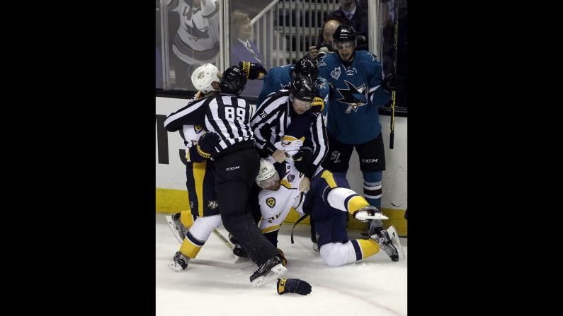 Members of the Nashville Predators and the San Jose Sharks fight at the end of an NHL playoff game on Saturday, April 30. The Sharks had just won Game 1 of the second-round series.