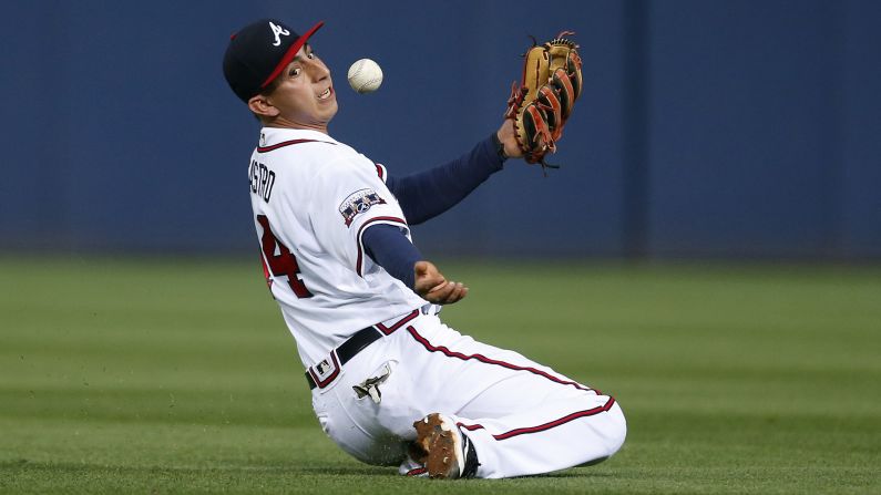 Atlanta's Daniel Castro bobbles a pop fly hit by Boston's Mookie Betts on Tuesday, April 26. Castro made the catch.