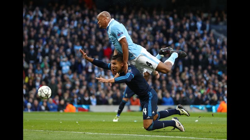 Manchester City defender Vincent Kompany, top, collides with Real Madrid's Casemiro on Tuesday, April 26, during the first leg of their Champions League semifinal. The match ended scoreless in Manchester, England.