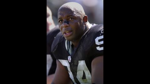 Oakland Raiders defensive tackle Dana Stubblefield takes a break in 2003 on the sidelines against the Cincinnati Bengals. 