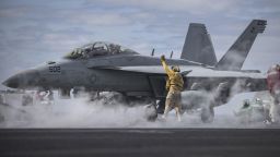 U.S. Navy Chief Warrant Officer 3 Hector Arroyo signals to an E/A-18G Growler, assigned to the Electronic Attack Squadron (VAQ) 130, on the flight deck of the aircraft carrier USS Dwight D. Eisenhower (CVN 69) in the Atlantic Ocean, April 11, 2016. The Eisenhower was underway preparing for an upcoming scheduled deployment. (U.S. Navy photo by Mass Communication Specialist 3rd Class J. Alexander Delgado)