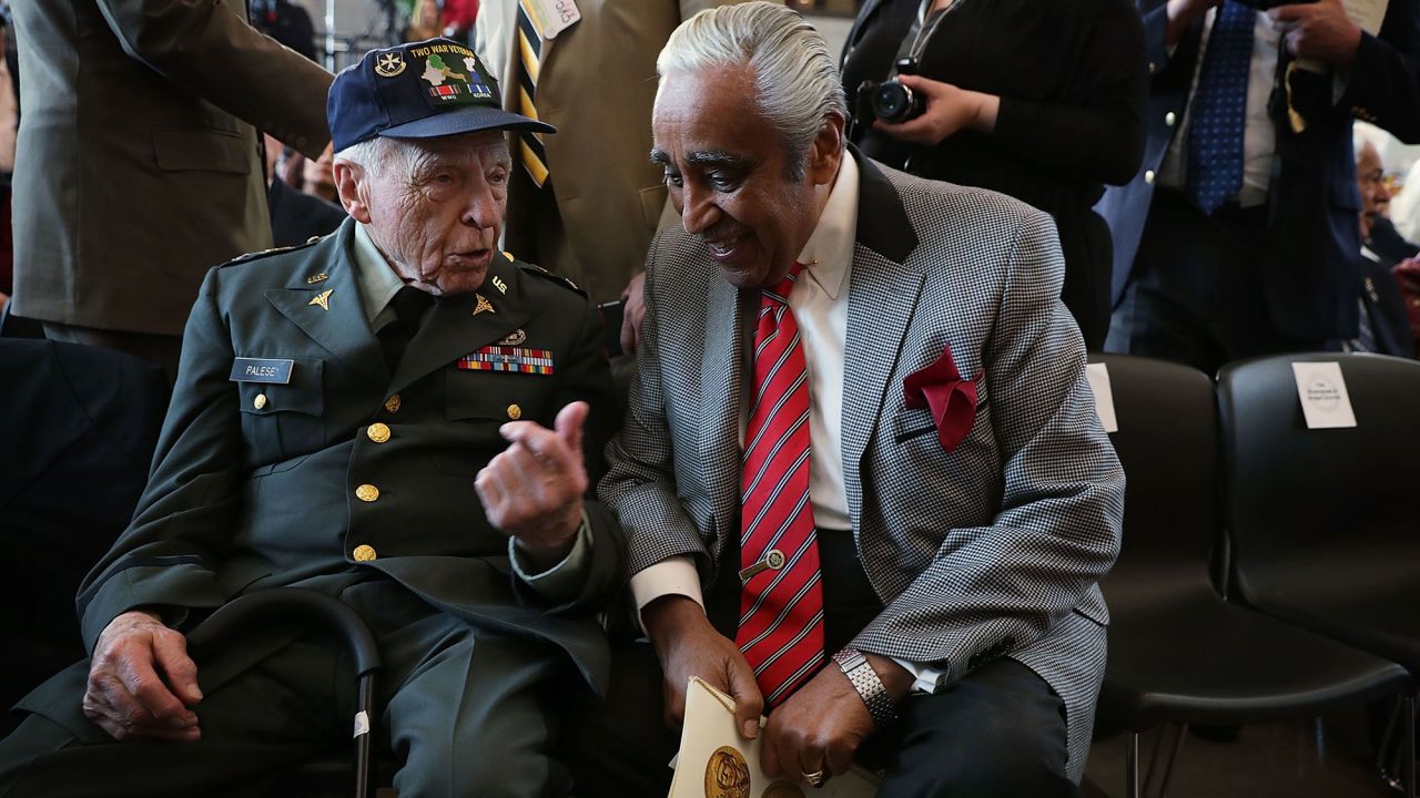 U.S. Rep. Charles Rangel, right, listens to retired Army Col. John Palese before a medal ceremony in Washington on Wednesday, April 13. The Congressional Gold Medal was awarded to Palese and other members of the 65th Infantry Regiment -- a Puerto Rican unit that served in World War I, World War II and the Korean War.