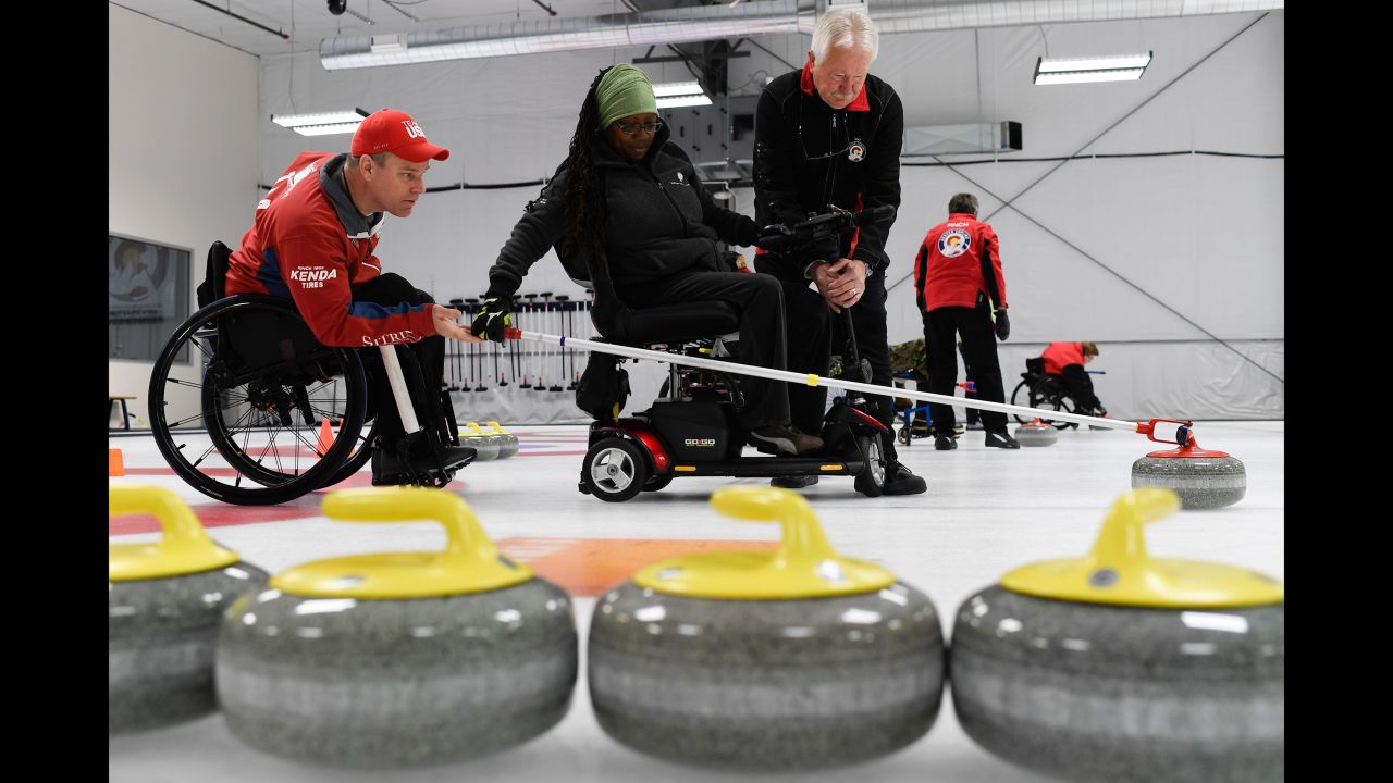 Disabled U.S. veterans take part in a curling camp in Denver on Thursday, April 14.