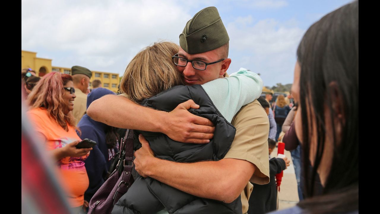 A U.S. Marine hugs a loved one after recruits were released to their families in San Diego on Thursday, April 28. Graduation was the next day. 