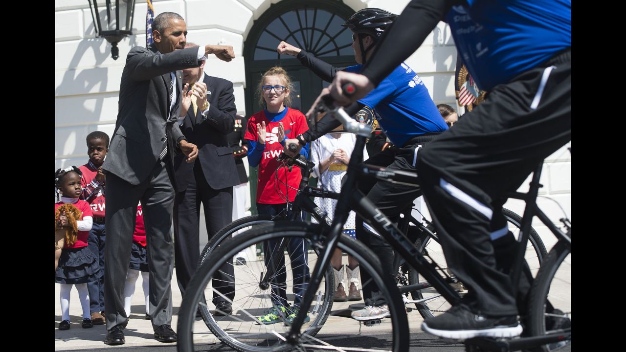 U.S. President Barack Obama gives a fist-bump at the start of the Wounded Warrior Ride in Washington on Thursday, April 14.