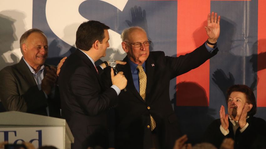 Ted Cruz (R-TX) hugs his father Rafael Cruz, as his mother Eleanor Darragh looks on at the  caucus night gathering at the Iowa State Fairgrounds on February 1, 2016 in Des Moines, Iowa.