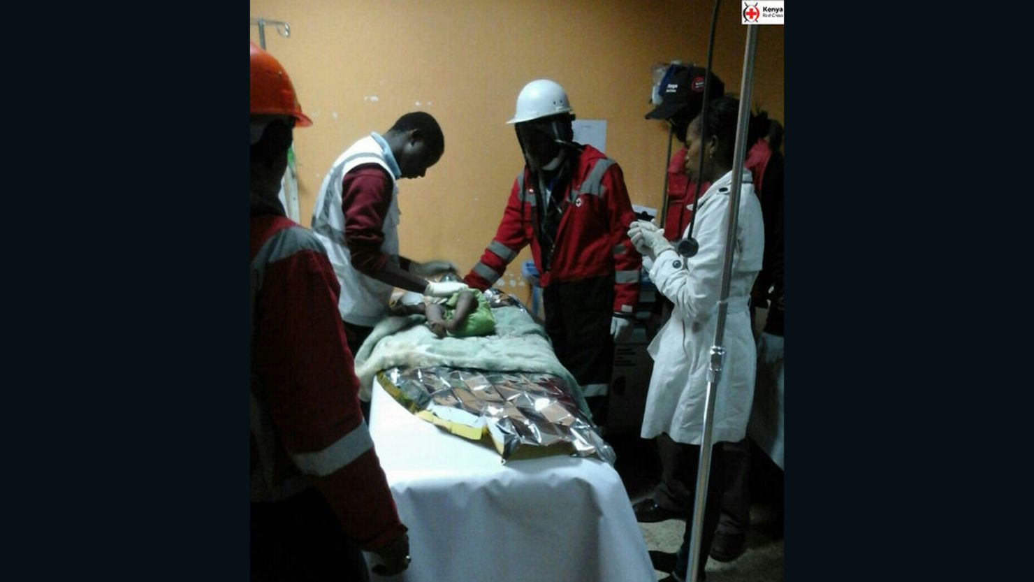 A baby girl receives treatment after being rescued from the rubble of a building in Nairobi.