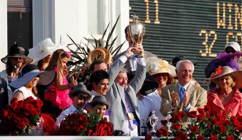 Reddam (C) and jockey Mario Gutierrez celebrate after I'll Have Another's Kentucky Derby success in 2012.