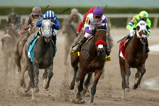 Nyquist #4, ridden by Gutierrez, leads Mohaymen #9, ridden by Junior Alvarado, out of turn four during the 2016 Florida Derby at Gulfstream Park April 2, 2016 in Hallandale, Florida.