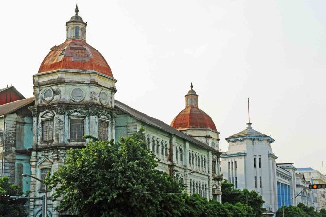 Originally built as the Currency Department, the Yangon Division Court building on Pansodan Street is one of the most fascinating buildings in the city. Damage sustained during a World War II bombing raid is still visible on its octagonal corner domes. 
