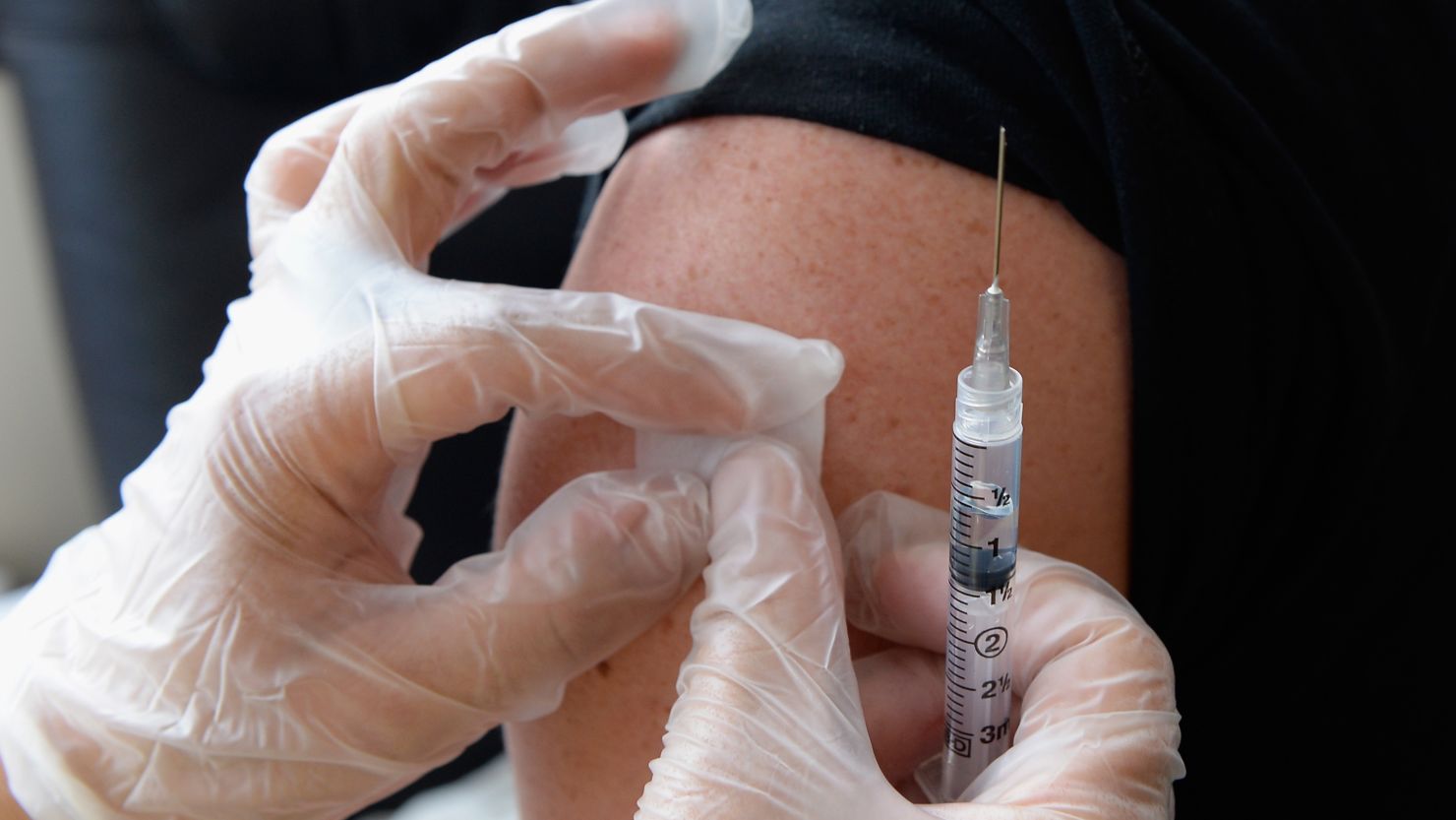 HOLLYWOOD, CA - APRIL 15:  People receive a free meningitis vaccine from  Dr. Wayne Chen at the AIDS Healthcare Foundation pharmacy on April 15, 2013 in Hollywood, California. The AIDS Healthcare Foundation started free meningitis vaccines after a West Hollywood man died from the disease.  (Photo by Kevork Djansezian/Getty Images)