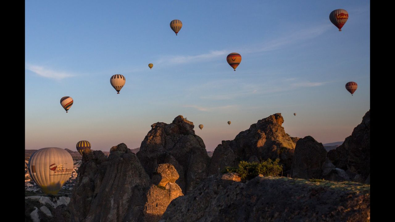 Hot-air ballooning is a popular tourist activity in Cappadocia, a UNESCO World Heritage Site in Central Anatolia. The area is characterized by a distinctive volcanic landscape and large network of ancient underground dwellings. 