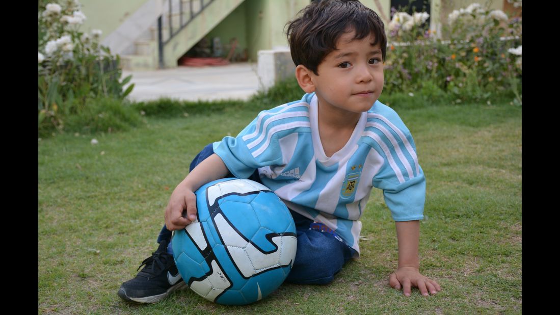 Murtaza Ahmadi, 5, gained worldwide fame after being photographed wearing a plastic bag with Lionel Messi's name on it. He and his family have fled rural Afghanistan for Pakistan after receiving threats, his father told CNN.