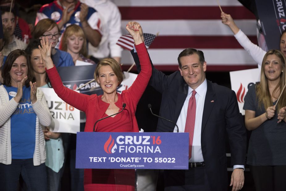 Cruz holds up the hand of Carly Fiorina at a campaign rally in Indianapolis on Wednesday, April 27. Cruz named Fiorina, a former presidential candidate, as his running mate.