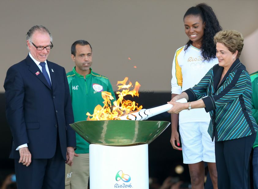Brazilian president Dilma Rousseff lit the Olympic torch in Brasilia Tuesday. The  torch will pass through 329 cities on its way to Rio de Janeiro where the Games begin on August 5.
