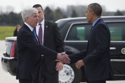 President Barack Obama shakes hands with Michigan Governor Rick Snyder upon his arrival in Flint, Michigan on May 4, 2016.
