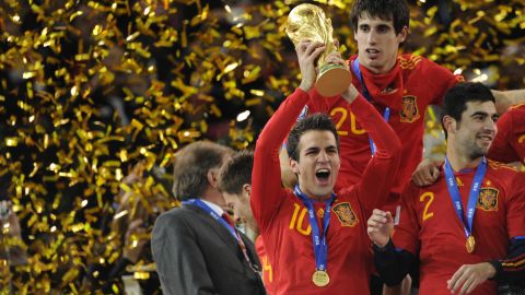 Cesc Fabregas, one of La Masia's graduates, holds aloft the World Cup trophy after Spain won the 2010 final