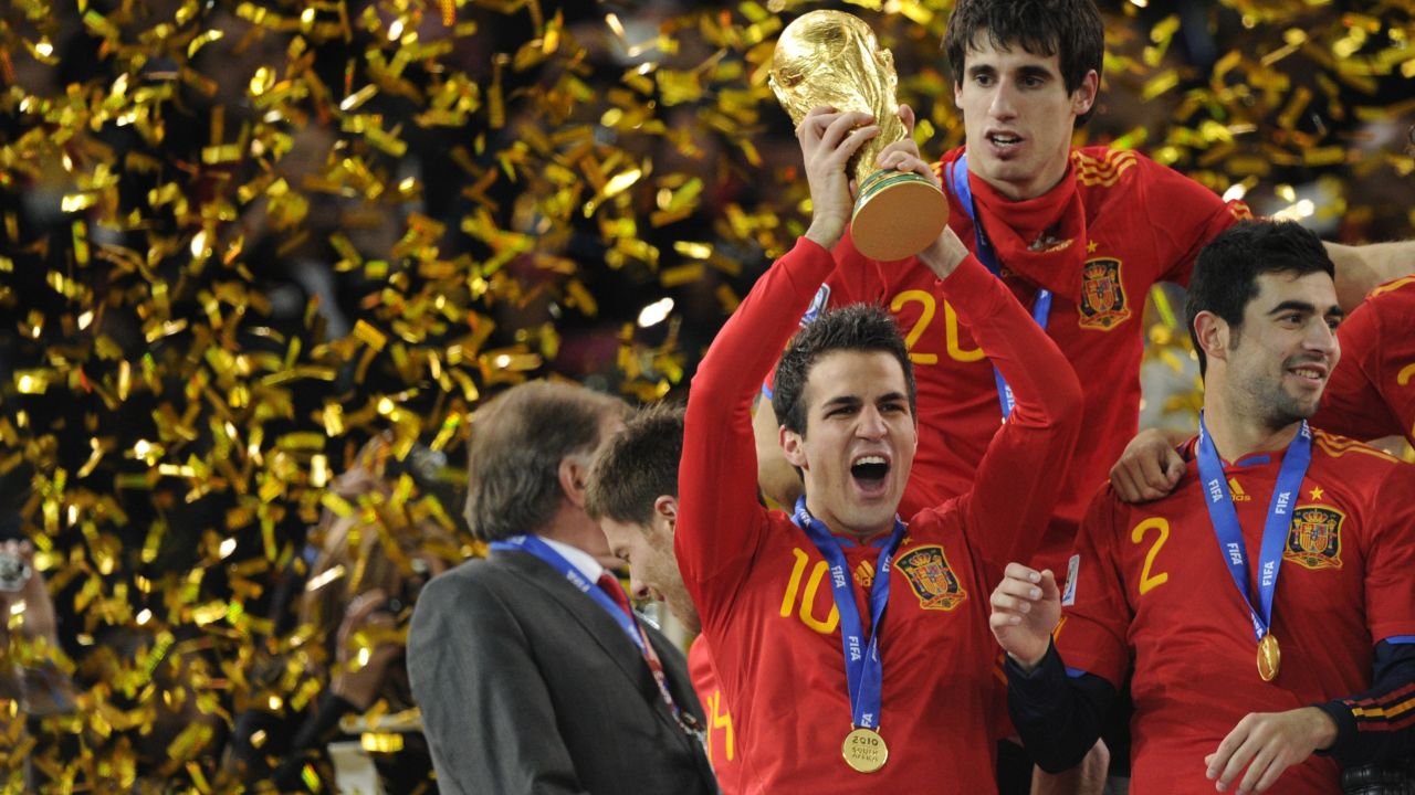 Cesc Fabregas, one of La Masia's graduates, holds aloft the World Cup trophy after Spain won the 2010 final