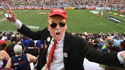A fan dressed as US Republican presidential hopeful Donald Trump poses in the crowd during day two of the Men's 2016 USA Sevens Rugby Tournament match at the Sam Boyd Stadium in Las Vegas, Nevada on March 5, 2016. / AFP / MARK RALSTON        (Photo credit should read MARK RALSTON/AFP/Getty Images)