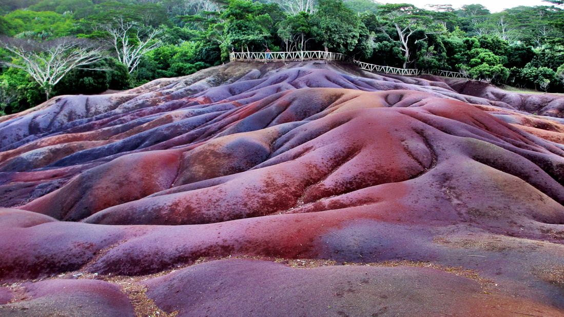 <strong>Chamarel: </strong>On an exposed hilltop on the Chamarel plain, the earth takes on magical rainbow hues of purple, red, violet, green, blue and yellow.