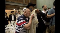 epa05286877 Holocaust survivors wrapped in phylacteries and Tefillin during their Bar Mitzvah ceremony at the Western Wall in Jerusalem's Old City, Israel, 02 May 2016. Some 50 Holocaust survivors who were in concentration camps at the age of 13 celebrate their late Bar Mitzvah ceremony with thier families at the Western Wall in Jerusalem, Judaisms holiest site. The Jewish Bar Mitzvah ceremony is usualy celebrated for boys at the age of 13 and marking the child's adolescence transformation from boy into a man.  EPA/ABIR SULTAN