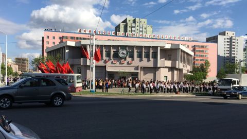 A student band outside Hyoksin (Innovation) Station is tasked with lifting the spirits of Pyongyang citizens so they'll work harder during the "70 day battle" leading up to the congress.