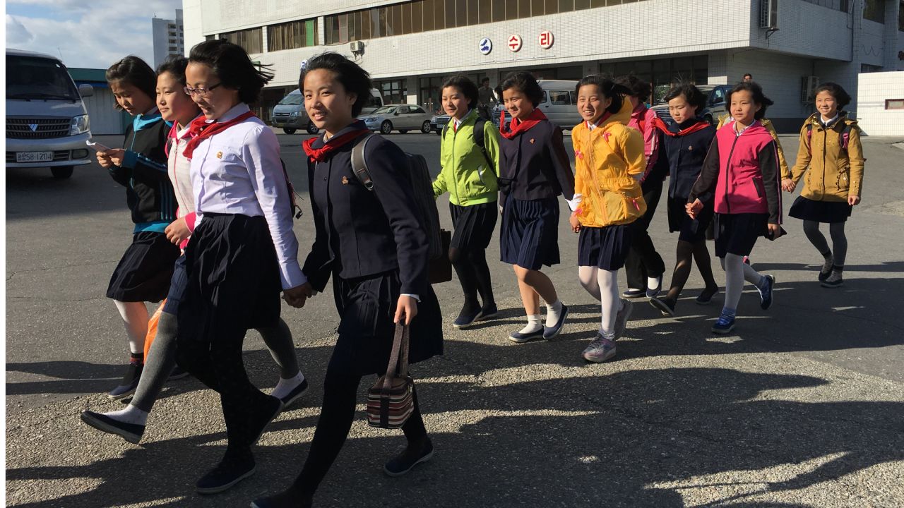 Secondary school students walk home in a group along Kwangbok "Liberation" street in Pyongyang on May 4 after a day of work and rehearsals for the upcoming congress.