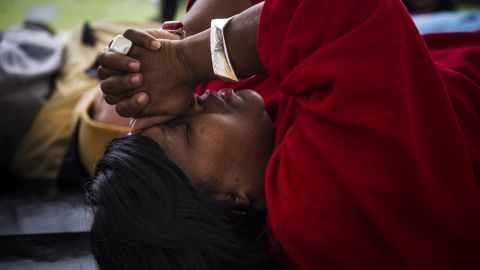 Linda Wilder-Bryan, whose son Lawrence was killed in a shooting in August, prays during a "die in, lay in" protest this year.