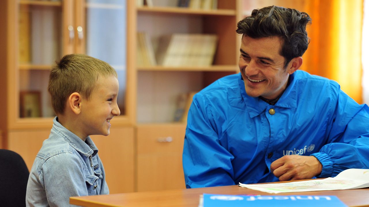 A pupil at School #2 in Myronivskyi, near the front line in conflict-torn eastern Ukraine, meets with Orlando Bloom.