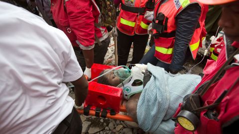 Medics carry a woman on May 5, 2016, after she was pulled from the rubble of a collapsed building in Nairobi, Kenya. She was trapped in the rubble for six days. Click through for more amazing stories of survival, including the saga of Chilean miners, a man aboard the Costa Concordia and the "miracle babies" of the Mexico earthquake.