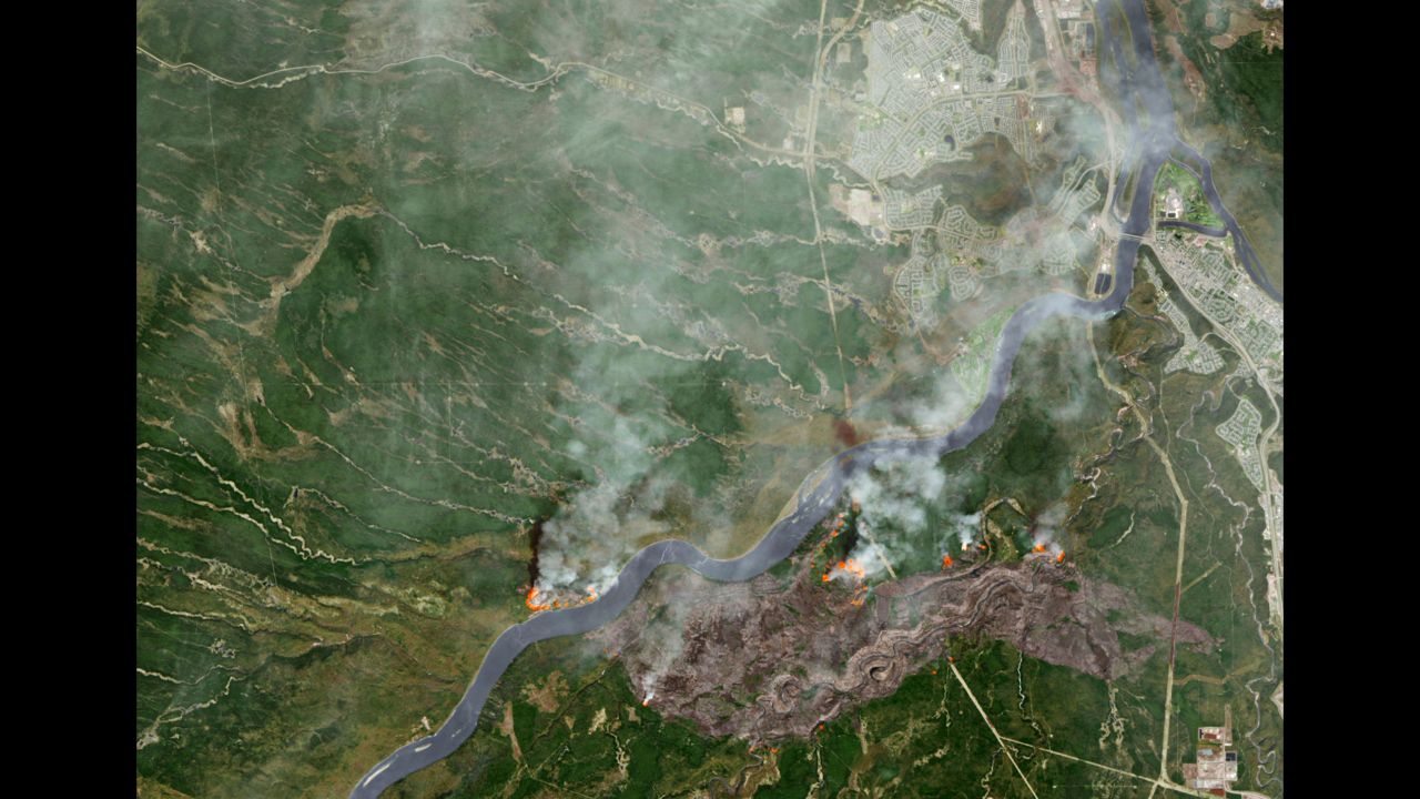 The wildfire burns through northern Alberta in this image released by NASA on May 3.