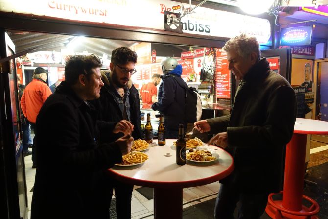 Ox & Klee chef Daniel Gottschlich, left, and friend Dimi Katsavaris meet Bourdain for some authentic German street food including currywurst and Spiessbraten.