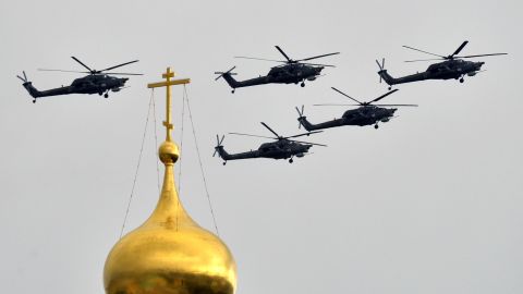 Russian Mil Mi-28 helicopter gunships fly above the Kremlin's cathedrals in Moscow, on May 7, 2014.
