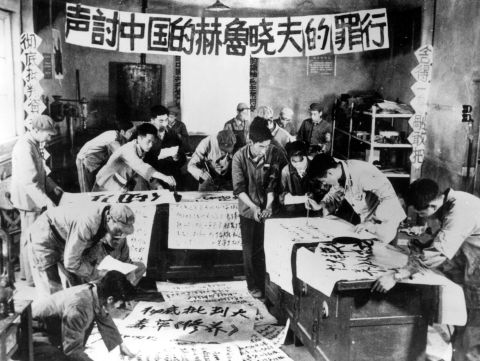 Cultural Revolution activists write anti-capitalist slogans. 