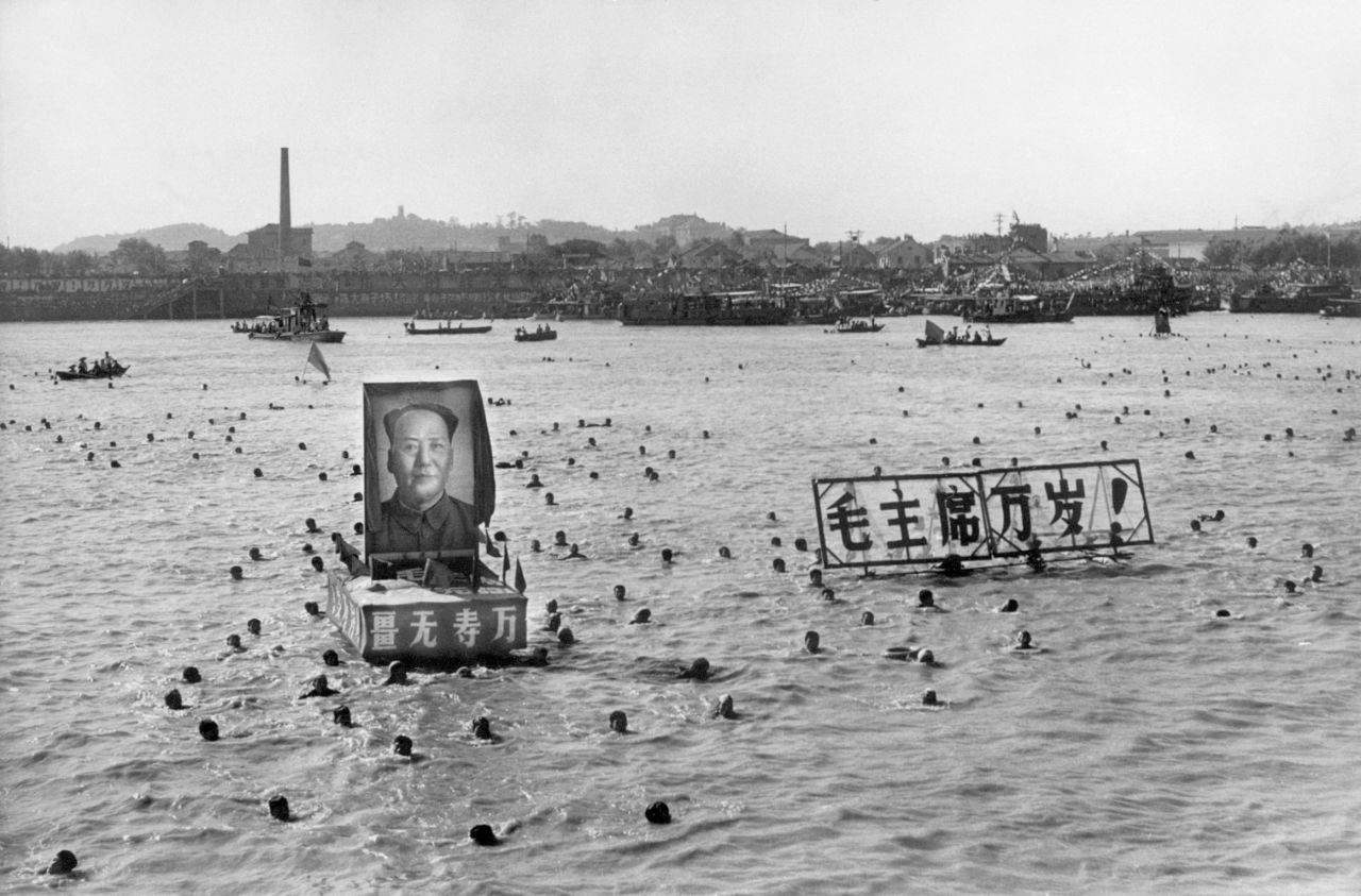 Hundreds of people follow Mao Zedong's example by swimming in the Yangtze near Wuhan in Hubei province.