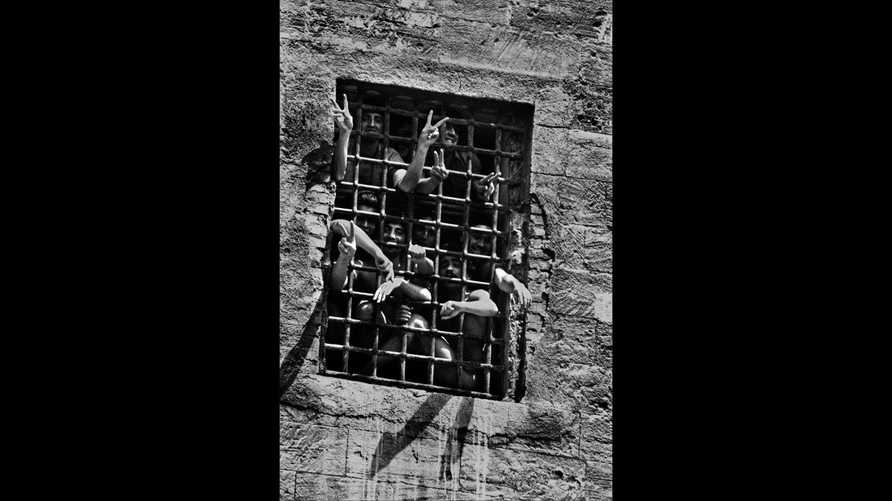 Prisoners are seen behind bars in Palermo in 1983.