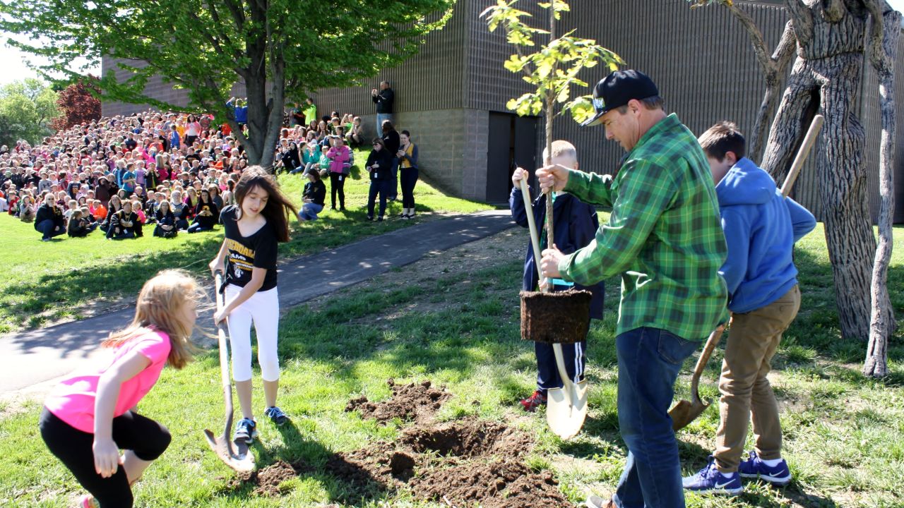 Chad Pregracke and his nonprofit surprised students by planting the group's 1 millionth tree at their school.