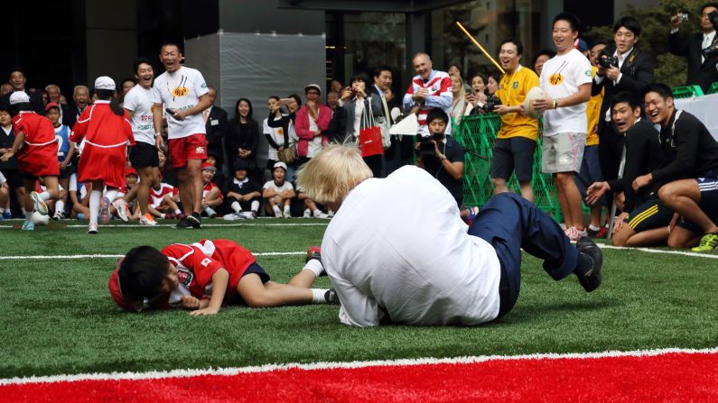 London Mayor Boris Johnson <a href="index.php?page=&url=http%3A%2F%2Fwww.cnn.com%2F2015%2F10%2F15%2Fsport%2Flondon-mayor-boris-johnson-rugby%2Findex.html" target="_blank">knocks over 10-year-old Toki Sekiguchi</a> during a touch rugby game in Tokyo on October 15, 2015. "I accidentally flattened a 10-year-old on TV unfortunately," Johnson said in a speech to British and American businessmen. "But he bounced back, he put it behind him. The smile returned rapidly to his face."