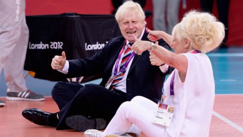 Johnson and actress Barbara Windsor play sitting volleyball after a Paralympics match in London on August 31, 2012.