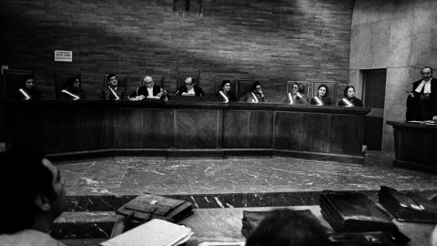 Anti-Mafia judges sit in a courtroom in Sicily in 1981.