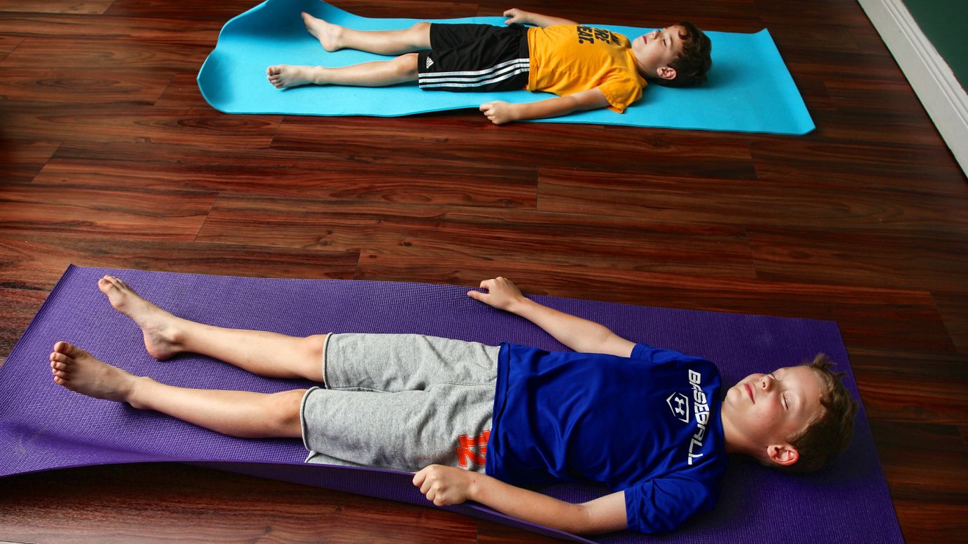 Imagining their yoga mats as magic carpets helps the boys learn mindfulness.