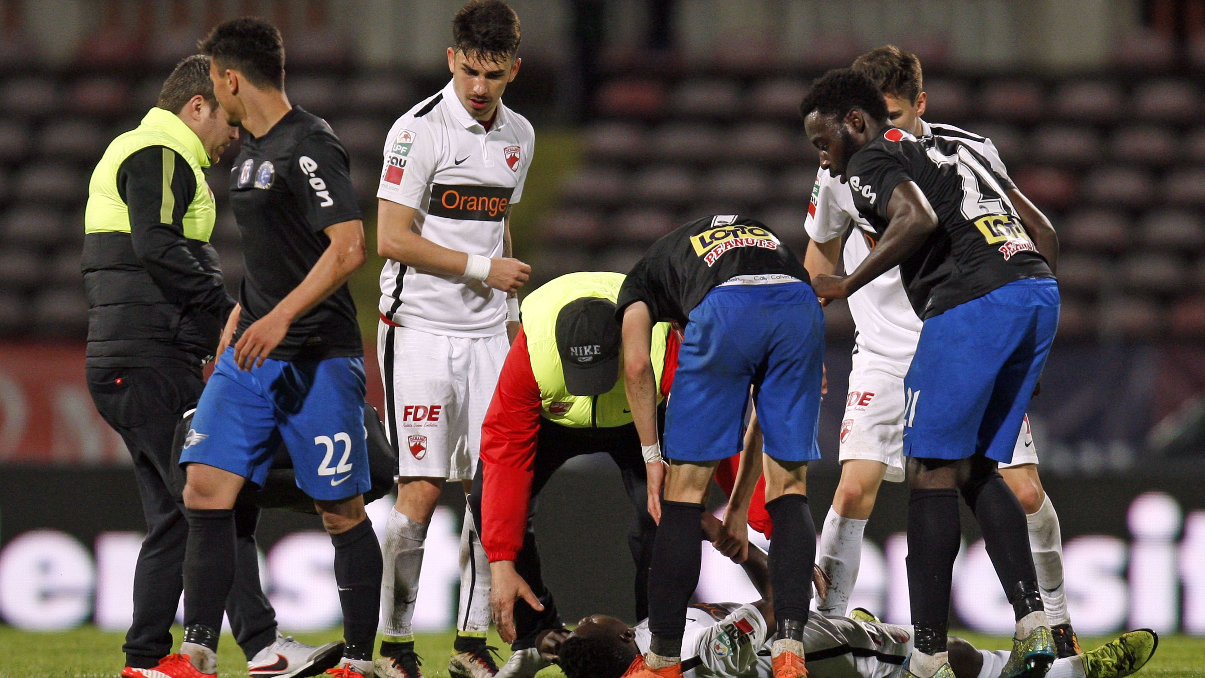 Cameroonian international soccer player Patrick Ekeng lies on pitch after he collapsed during the match between Dinamo Bucharest and Viitorul Constanta in the Romanian capital of Bucharest on Friday. 
