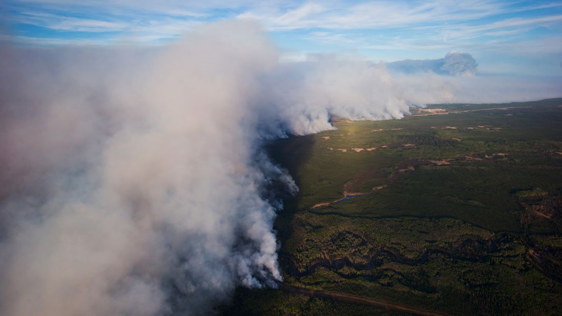 A huge plume of smoke from the wildfires rises over Fort McMurray in this aerial photograph taken on May 6.