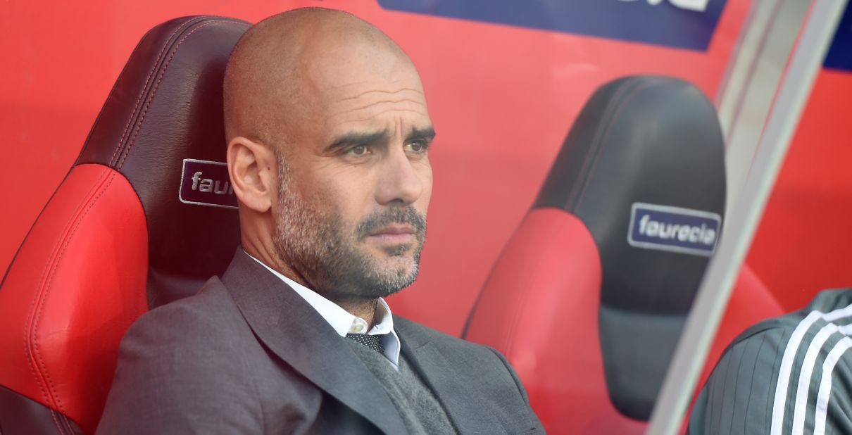 Bayern manager Pep Guardiola watches on from the sidelines.