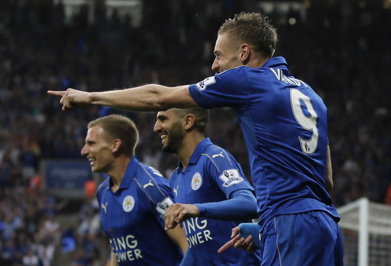 Leicester players celebrate Vardy's early goal.