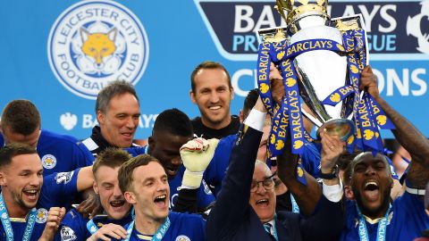 Captain Wes Morgan and manager Claudio Ranieri of Leicester City lift the Premier League trophy.