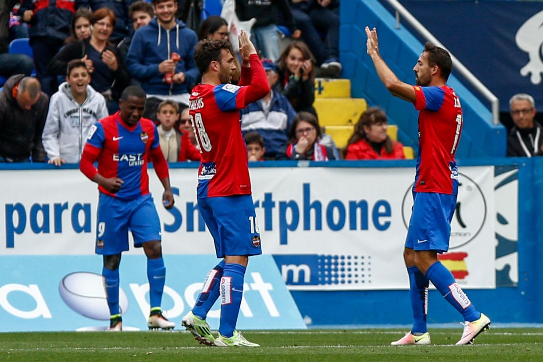 Levante's Victor Casadesus (center) celebrate after scoring against Atletico Madrid.