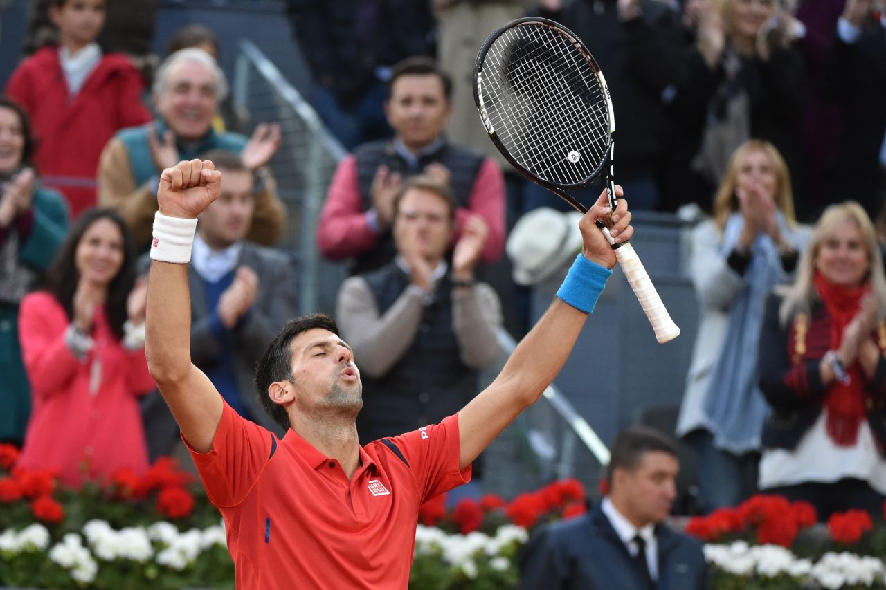 Novak Djokovic celebrates beating Andy Murray in the final of the 2016 Madrid Open.