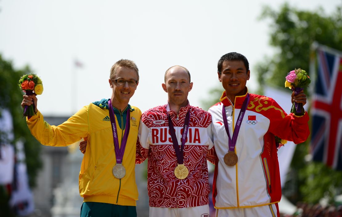 Jared Tallent (L) and Sergey Kirdyapkin (C) on the podium after the London 2012 Olympic Men's 50km race walk.